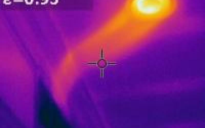 Ghosts? No, just the cold air return drawing in hot humid air from the attic through an unsealed can light.